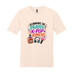 Cream t-shirt featuring headphones, a jar of kimchi, and the phrase 'Running on Prayer, K-Pop & Kimchi'